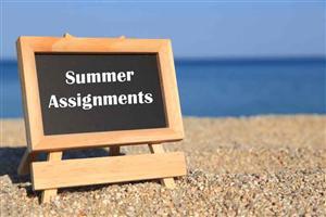  easel on sand with words summer assignment