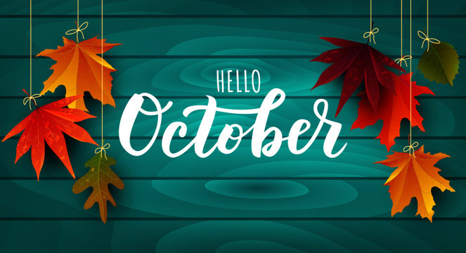  The word October with leaves hanging from strings
