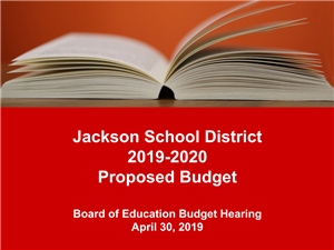 cover page of budget presentation showing book on red background 
